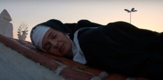 Letrux é uma freira em fuga no videoclipe “Dorme Com Essa”